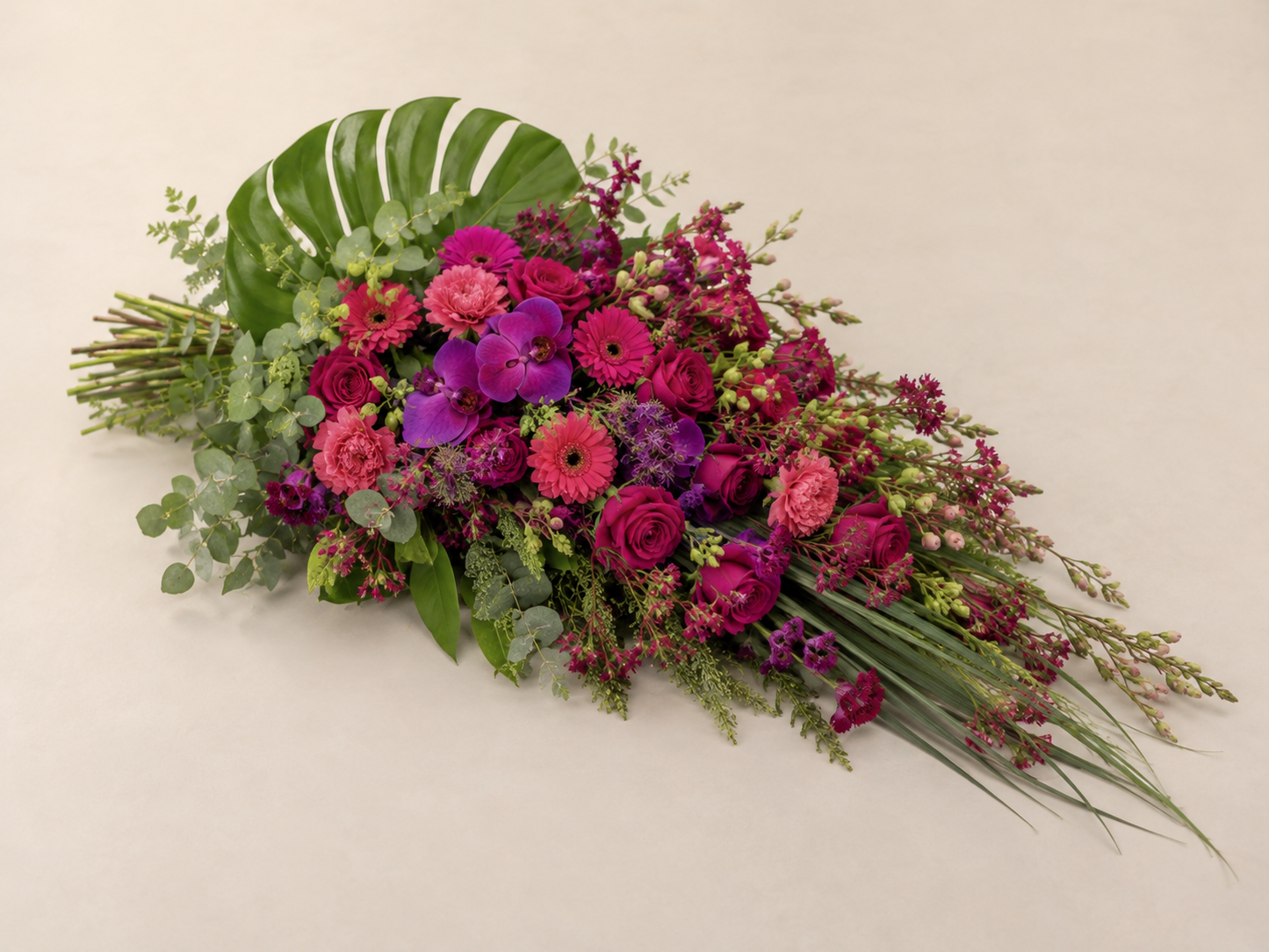 Fuchsia & Purple Funeral Sheaf | Elegant Sympathy Bouquet Online