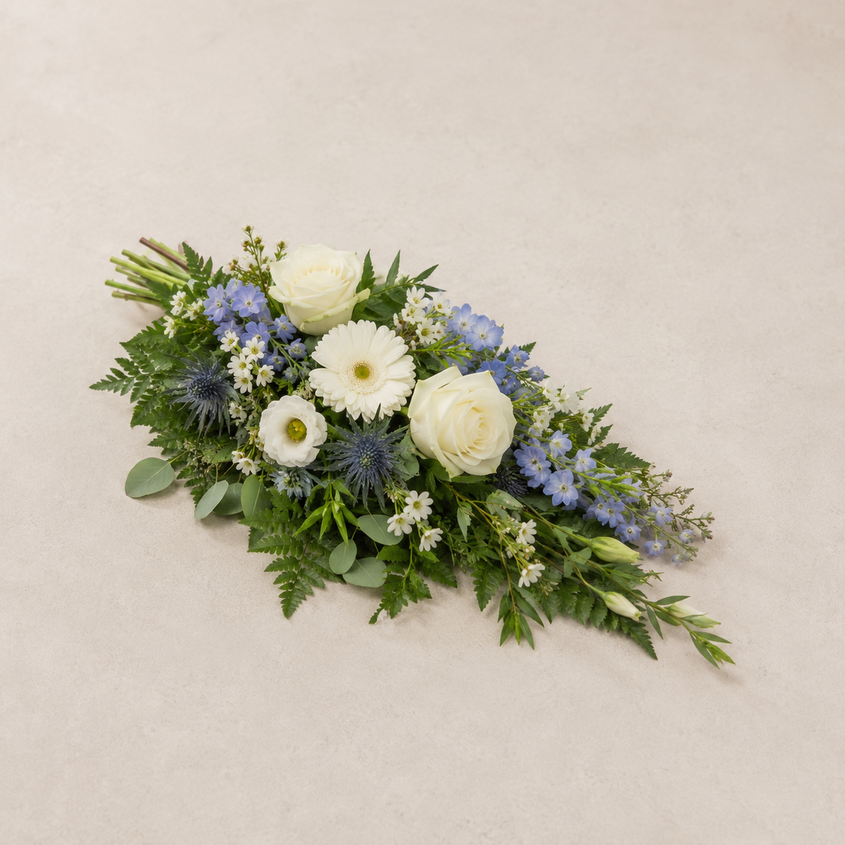 Blue & White Funeral Sheaf | Peaceful Casket Bouquet Online